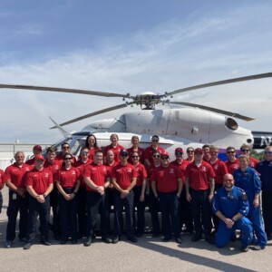 Arch Group Shot outside of Helicopter